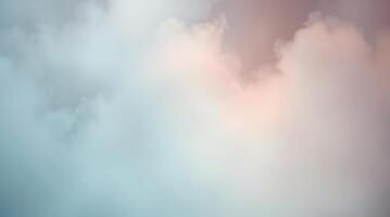 A plane flying through the clouds with a pink and blue sky photo