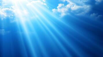 Sunlight beams breaking through clouds high in sky photo