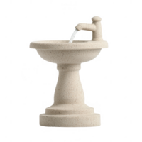 A modern stone fountain providing fresh water in a serene setting. png