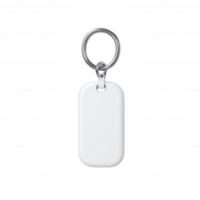 A simple white keychain with a silver ring, perfect for personalizing or organizing keys. png