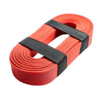 Coiled red resistance band for strength training and fitness exercises. png