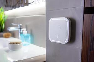 Modern bathroom with smart device and stylish decor elements photo
