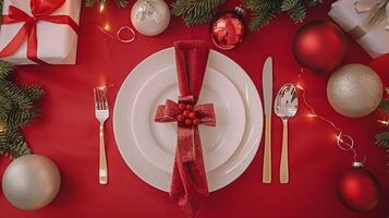 Elegant christmas table setting with festive red and gold decorations photo
