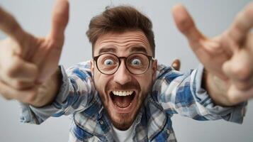 Excited young man celebrating success with a joyful expression photo