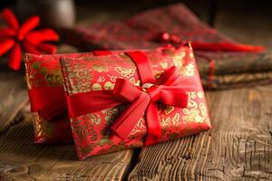 Elegant red gift packages with intricate patterns on rustic wooden table photo