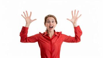 Excited woman in red blouse expressing joy with raised hands photo