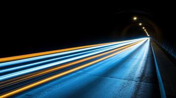 Light trails in a tunnel with blue and yellow lights photo