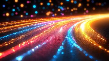 A long line of lights on a road at night photo