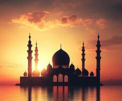 Majestic mosque silhouette against vibrant sunset sky over water in serene landscape photo
