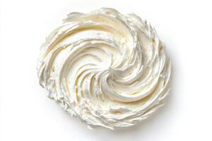 Whipped cream beautifully swirled onto a plain surface ready for dessert decoration or culinary use photo