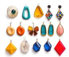 Beautiful collection of colorful earrings displayed on a white background showcasing unique designs and materials photo