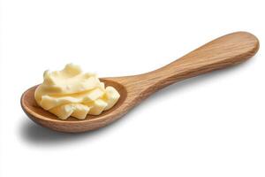 Butter resting on a wooden spoon, ready for cooking and baking in a cozy kitchen setting photo
