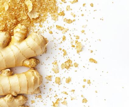 Ginger root and dried ginger powder on a white background showcasing a natural spice preparation photo