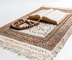 Mats and scriptures arranged with prayer beads for spiritual reflection in a serene environment photo