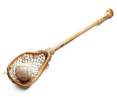 Traditional lacrosse stick with a ball resting in the netting showcases craftsmanship and the sport's roots photo