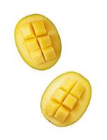 Fresh mango halves cut into cubes showcasing vibrant yellow flesh and smooth skin ready for consumption or culinary use photo