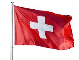 Swiss flag waving under blue sky during a sunny day in Switzerland photo