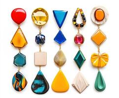 Colorful collection of geometric earrings displayed on a white background showcasing vibrant design and unique shapes photo