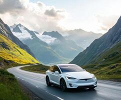 Scenic drive through a mountainous landscape with a white electric vehicle under a cloudy sky photo