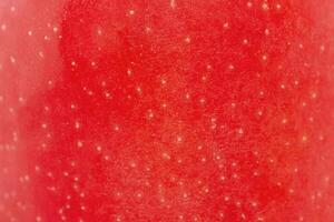 Texture of a red apple as a background macro photo. photo