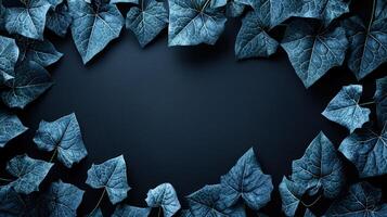Deep blue ivy leaves create a captivating border around a dark void photo