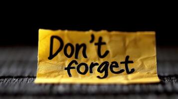 A crumpled yellow note encourages memory amidst daily distractions photo