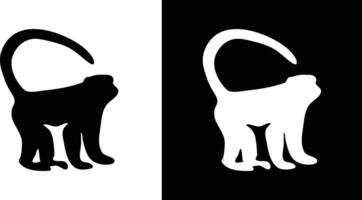 A minimalistic depiction of a monkey silhouette using contrasting black and white colors arranged side by side vector