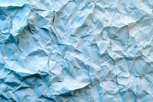 Textured Blue Wrinkled Paper Background for Design and Art Projects photo