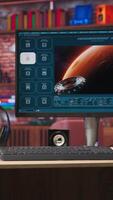 Vertical AI program turning text prompt into videos results. Monitor in desk surrounded by plants showing text to artificial intelligence generative model, handheld camera shot