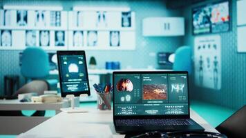 Empty medical office equipped with diagnostic tools and blood pressure monitor set for healthcare consultations and medical research to provide accurate diagnosis and patient care. video