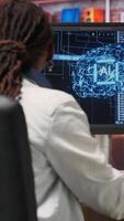 Vertical Freelancing computer engineer doing maintenance on artificial intelligence systems. Remote tech support specialist at working from home, doing checkup on AI systems, happy with results, camera B video