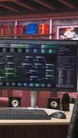 Vertical Programming software UI on computer monitor in apartment office. Machine learning application on PC screen used to write and test code in modern apartment, handheld camera shot video