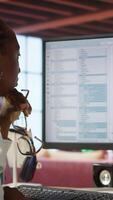 Vertical Disappointed engineer in home office looking at UI on computer monitor, failing to properly execute programming code. Displeased IT worker seeing errors while using coding application, camera A video