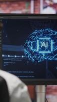 Vertical Programmer using computer at home for artificial intelligence computing simulating human brain through self learning algorithms. Employee working with AI deep neural networks on desktop PC, camera B video