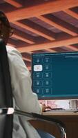 Vertical Woman at home using generative artificial intelligence website generating videos using diffusion models. Person drinking coffee and using AI virtual assistant producing clips, camera B