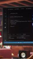 Vertical IT engineer drinking coffee, using computer at home for artificial intelligence computing. Close up of remote worker working with AI deep neural networks on desktop PC, camera A video