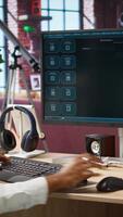 Vertical Woman seated at desk using AI LLM chatbot software in modern urban home office. Person requesting help from large language model program on computer in bright apartment workspace, camera A video
