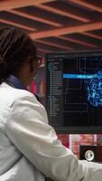 Vertical Freelancing computer engineer doing maintenance on artificial intelligence systems. Remote tech support specialist at working from home, doing checkup on AI systems, happy with results, camera A video