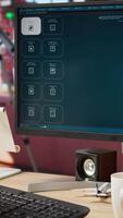 Vertical Woman in apartment using AI software turning text prompt into photos, drinking coffee and listening music. African american person in cozy home uses text to image generative models on PC, camera A video
