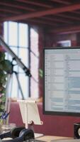 Vertical System administrator types code into PC, developing software, entering commands. IT professional at home fixing errors in application, implementing new features, listening music, camera B video
