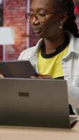 Vertical Teleworker at home happy to end job shift, closing laptop and leaving desk after finishing tracking expenses and syncing statements with digital software on notebook, camera B video