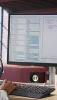 Vertical Woman feeling worried while looking at UI on PC screen, having trouble executing programming code. Anxious IT developer concerned by errors popping up while testing code in apartment, camera B video