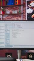 Vertical Lines of code written on PC workstation screen on development tool application. Debugging software programming language displayed on computer monitor in living room office video