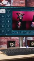 Vertical Computer in home office showing program converting text prompts into photo output, close up. Text to image generative models AI tech software on computer display in apartment, handheld camera shot video