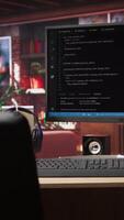 Vertical Development console visible on computer screen in modern apartment workspace. Software tools and lines of code displayed on PC monitor in home living room, technology concept video
