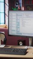 Vertical Lines of code written on PC workstation screen on development tool application. Debugging software programming language displayed on computer monitor in living room office video