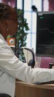 Vertical Day trader using PC, upset after purchased stocks performed bad and lost value, throwing paperwork. Forex trader frustrated after missing window of opportunity to sell stock exchange, camera B video