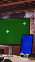Vertical Remote employee in home office using green screen PC and mockup tablet to work on job tasks. Teleworker using chroma key computer monitor and isolated screen device to do job online, camera A video