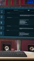 Vertical AI LLM chatbot answering user prompts using predictive technology in home office. Computer setup in apartment workspace using large language model program with artificial intelligence, panning shot video