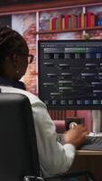 Vertical Teleworking programmer using computer for artificial intelligence computing through self learning algorithms. Remote worker working with AI deep neural networks on desktop PC, camera B video